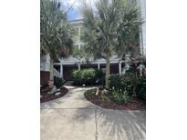 Attractive building exterior with landscaping and walkway at 1538 Lanterns Rest Rd. # 303, Myrtle Beach, SC 29579