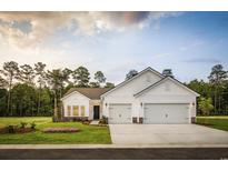 Stunning two-car garage home with white exterior at Lot 721 Zoe Way, Myrtle Beach, SC 29588