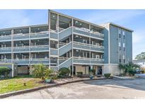 Multi-story building with balconies and parking at 1101 Possum Trot Rd. # C205, North Myrtle Beach, SC 29582