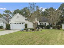 Charming one-story house with attached garage and manicured lawn at 490 Blackberry Ln., Myrtle Beach, SC 29579