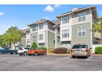 Exterior of Culbertson building with parking lot at 84 S Addison Cottage Way # 213, Murrells Inlet, SC 29576