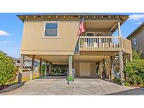 Elevated beach house with parking underneath at 9508 Guest Ct., Myrtle Beach, SC 29572