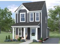 Two-story gray house with white trim and porch at 9112 Mabel Ct., Longs, SC 29568