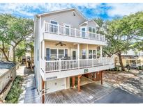 Two-story beach home with large deck and covered parking at 6001 - 1123 S Kings Hwy., Myrtle Beach, SC 29575