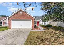 Brick ranch home with attached garage and red door at 419 Mckendree Ln., Myrtle Beach, SC 29579