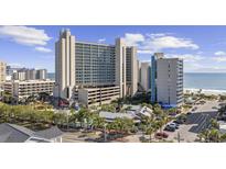 Aerial view of oceanfront resort with pool, parking and playground at 201 74Th Ave. N # 2749/50, Myrtle Beach, SC 29572