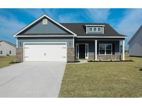 Gray house exterior with a white two-car garage at 612 Woodside Dr., Conway, SC 29526
