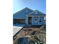 Newly constructed home with blue siding, white trim, and a two-car garage at 3116 Palma Way, Myrtle Beach, SC 29579