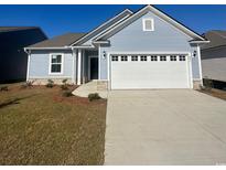 Newly built home with two-car garage and landscaping at 293 Hawks Run Dr., Calabash, NC 28467