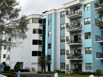 Multi-story building with light blue and white exterior at 5001 Little River Rd. # E115, Myrtle Beach, SC 29577