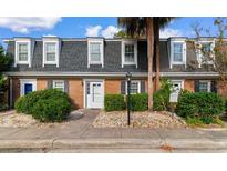 Brick townhouse with grey roof and landscaping at 4505 N Kings Hwy. # C3, Myrtle Beach, SC 29577