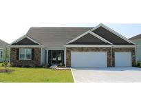 Beautiful two-story home with stone accents and two-car garage at 8967 Chesterfield Dr., Calabash, NC 28467