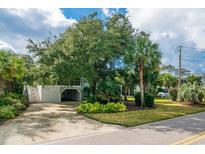 Attractive beach home with lush landscaping and a spacious driveway at 328 Windover Dr., Pawleys Island, SC 29585