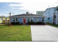 Newly built home with blue siding, red door, and concrete driveway at 309 21St Ave. N, North Myrtle Beach, SC 29582