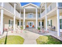 Attractive building exterior with columns, balconies, and landscaping at 5102 Sweetwater Blvd., Murrells Inlet, SC 29576