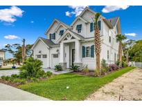 Two-story white farmhouse exterior with gray stone accents and teal shutters at 5810 N Kings Hwy., Myrtle Beach, SC 29577