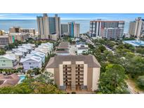 Aerial view of a condo building near the beach and other high-rise hotels at 310 73Rd Ave. N # 5-C, Myrtle Beach, SC 29572