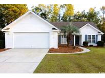White one-story house with two-car garage and landscaped yard at 172 Collins Glen Dr., Murrells Inlet, SC 29576
