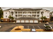 Three-story building with multiple units and garages at 4880 Dahlia Ct. # 305, Myrtle Beach, SC 29577