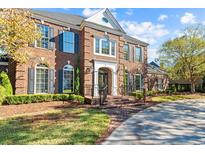 Brick house with gray shutters, a large front yard, and a paved driveway at 3754 Annandale Dr., Myrtle Beach, SC 29577