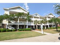 Attractive three-story building with ample parking and landscaping at 6203 Catalina Dr. # 1331, North Myrtle Beach, SC 29582