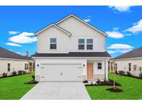 Two-story house with white siding, a peach door, and a two-car garage at 7010 Watercress St, Myrtle Beach, SC 29579