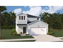 Two-story light blue house with white garage door and landscaping at 1333 Palm Springs Paloma Dr, Longs, SC 29568