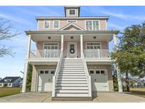 Three-story home with two-car garage and elevated front porch at 338 Harbour View Dr., Myrtle Beach, SC 29579