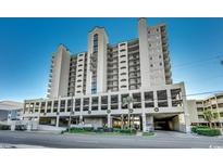 Coastal condo building with parking and ocean views at 1003 S Ocean Blvd. # 505, North Myrtle Beach, SC 29582