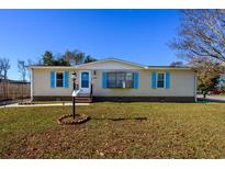 Cute single-story home with light-blue accents and well-maintained lawn at 1109 Cypress Cove, North Myrtle Beach, SC 29582