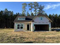 Newly constructed home with a two-car garage and dormer windows at 300 Palmetto Sand Loop, Conway, SC 29527