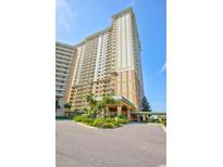 Oceanfront high-rise building with inviting entryway at 9994 Beach Club Dr. # 1806, Myrtle Beach, SC 29572