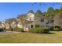 Two-story building exterior with landscaping and parking at 4499-H Girvan Dr. # H, Myrtle Beach, SC 29579