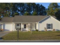Ranch style home with attached garage and well-maintained lawn at 706 Wintercreeper Dr., Longs, SC 29568