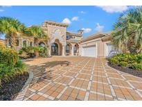 Grand two-story home with a large driveway and lush landscaping at 1501 Serena Dr., Myrtle Beach, SC 29579