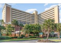 Oceanfront building with palm trees and ample parking at 6900 N Ocean Blvd. # 841, Myrtle Beach, SC 29572