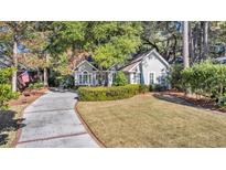 Attractive house with a landscaped lawn and a long driveway at 372 Doral Dr., Pawleys Island, SC 29585