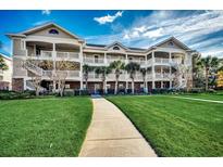 Attractive 3-story building with landscaped grounds at 5801 Oyster Catcher Dr. # 1022, North Myrtle Beach, SC 29582