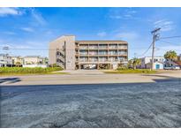 Three-story building, elevated, with parking underneath and ocean views at 120 Dogwood Dr. N # 313, Garden City Beach, SC 29576