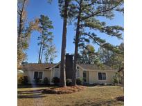 Cute ranch home with a brick chimney and mature landscaping at 169 Brookgate Dr., Myrtle Beach, SC 29579