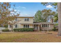 Charming two-story house with a well-maintained lawn at 917 9Th Ave. S, North Myrtle Beach, SC 29582