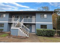 Updated condo building with stairs and landscaping at 1301 Pridgen Rd. # 1104, Myrtle Beach, SC 29577