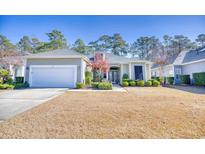 Attractive Craftsman style home with a two-car garage and manicured lawn at 190 Sugar Loaf Ln., Murrells Inlet, SC 29576