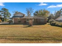 Brick ranch house with a large yard and detached garage at 2103 Loblolly St., Georgetown, SC 29440