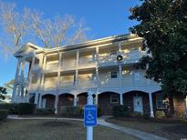Attractive 3-story building with ample parking and landscaping at 695 Riverwalk Dr. # 5-302, Myrtle Beach, SC 29579