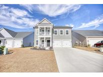 Charming two-story home with a two-car garage and a small front porch at 268 Empyrean Circle, Myrtle Beach, SC 29588