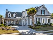 Charming two-story home with a gray exterior, white trim, and a welcoming front porch at 6105 Bolsena Place, Myrtle Beach, SC 29577