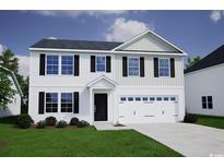 Charming two-story home with a two-car garage and landscaped front yard at 711 St. Albans Loop, Conway, SC 29526