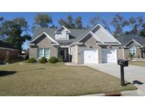 Charming two-story home with a two-car garage and landscaped front yard at 89 Preservation Dr., Myrtle Beach, SC 29572