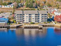 Multi-story waterfront condo building with private pier at 4445 Kingsport Rd. # 303, Little River, SC 29566